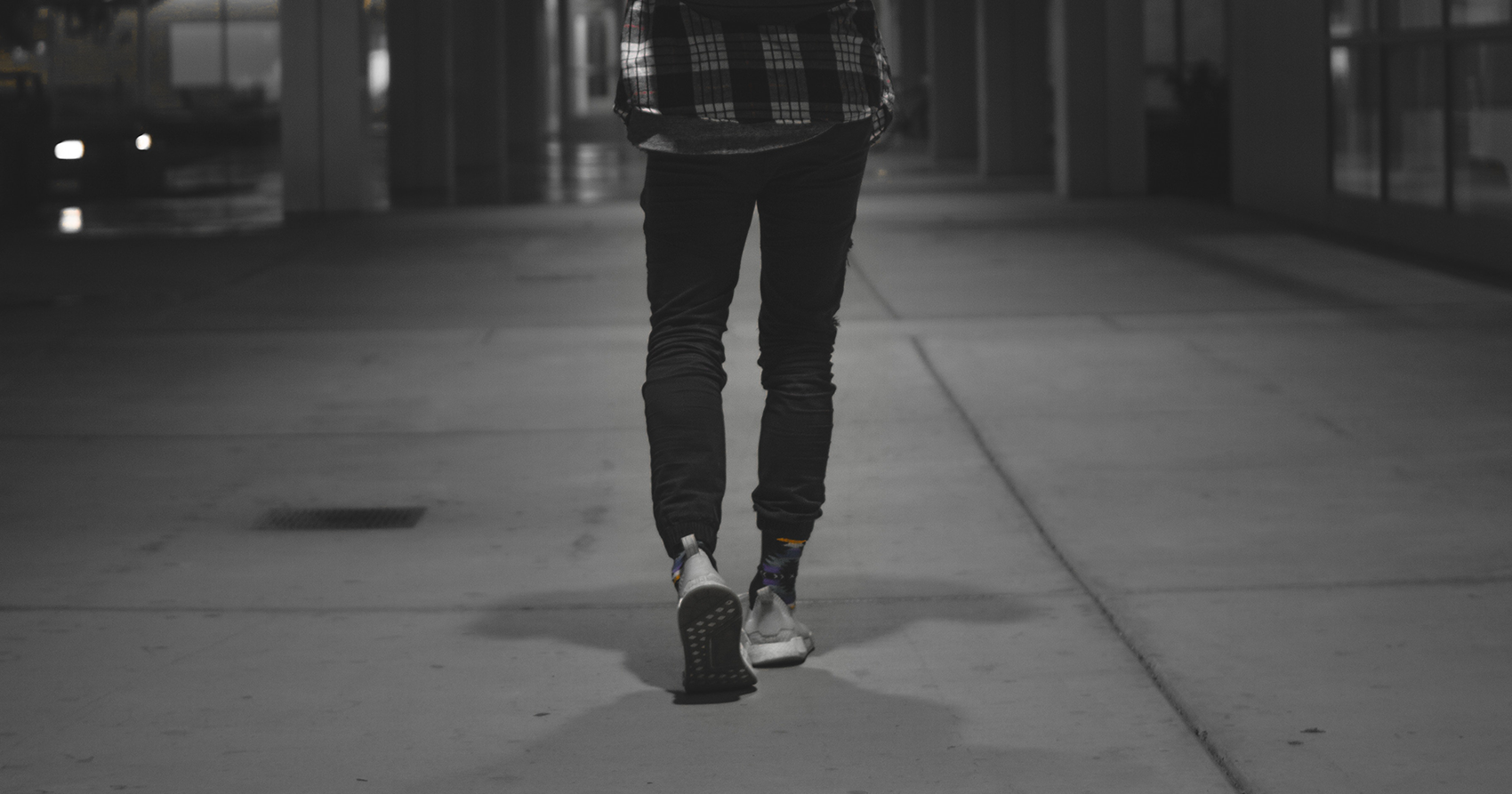 Person walking down dark street